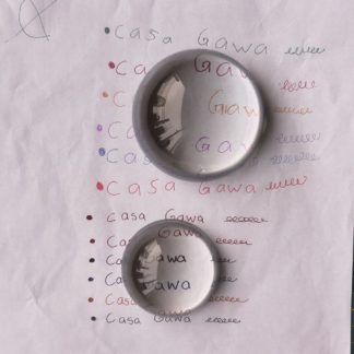 Pisa papel de vidrio semiesfera con aumento